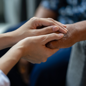 carer holding hands